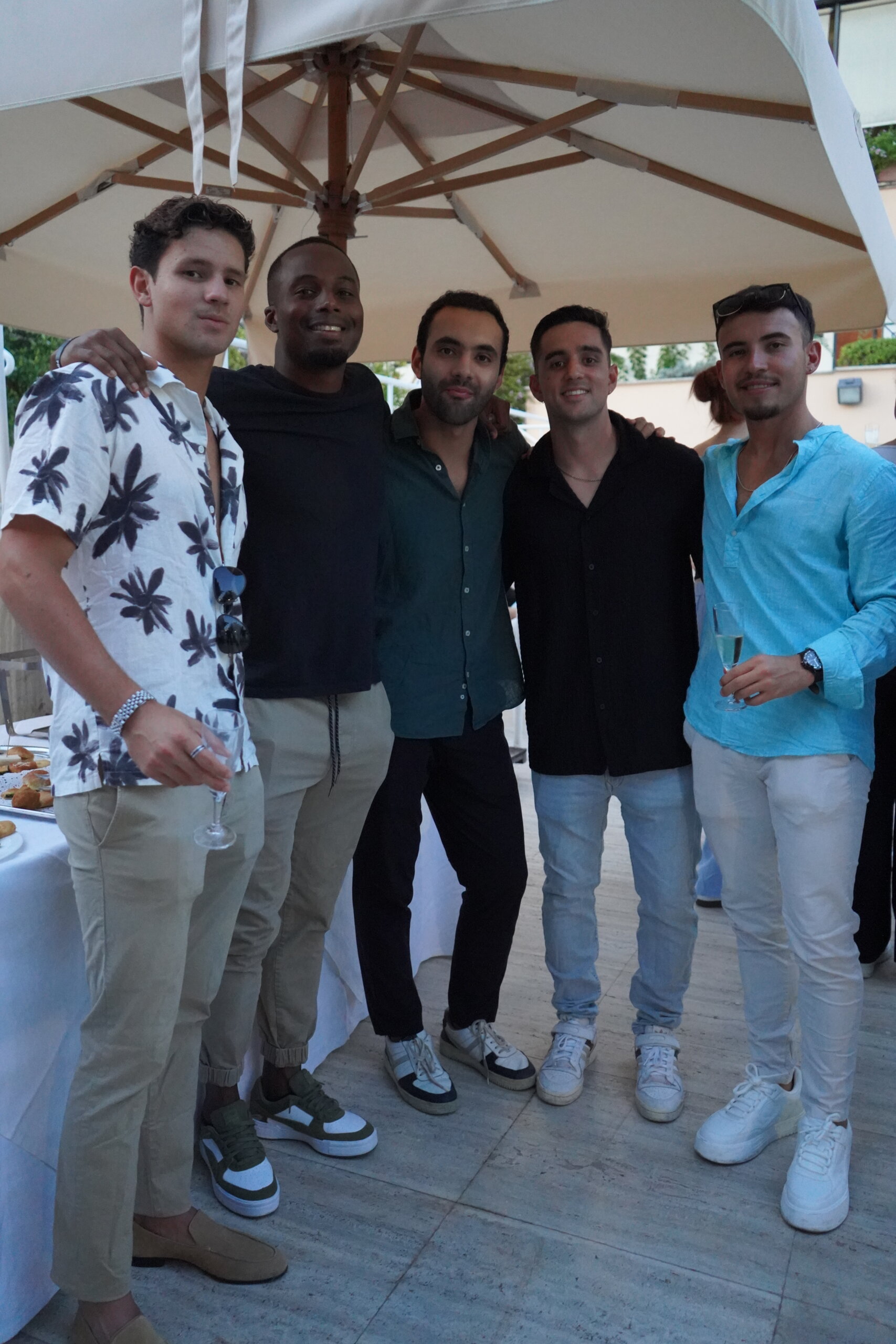 Students socializing at a rooftop event in Rome
