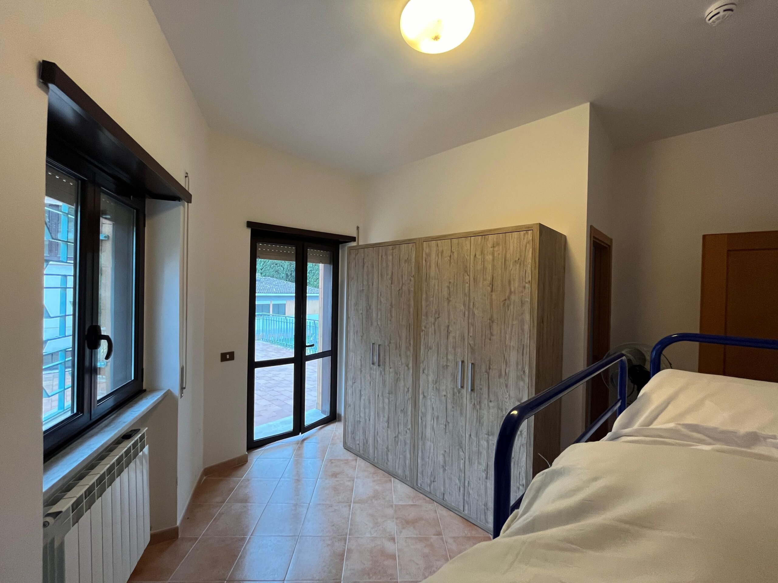 Rome City Prep Academy bedroom with balcony access