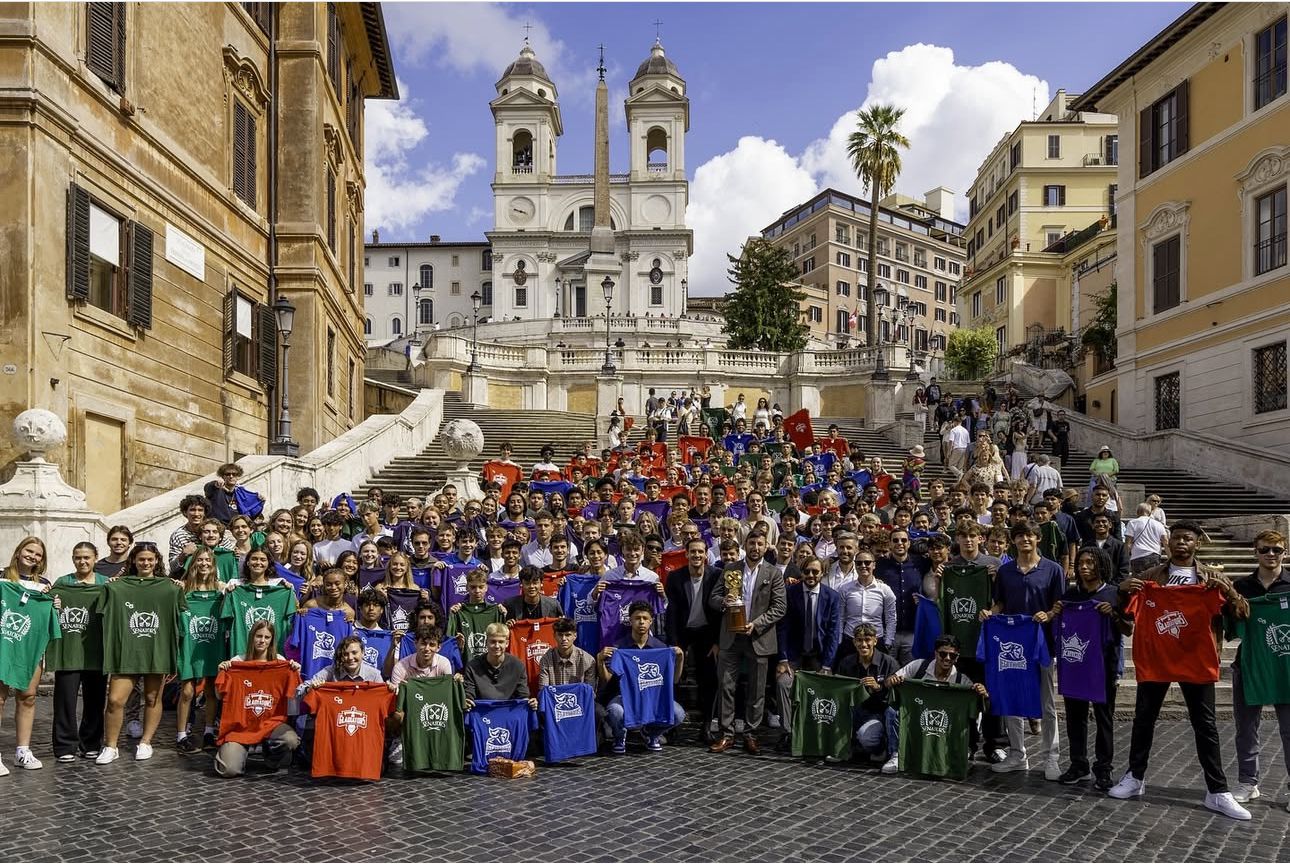 Large group of Rome City Institute students gathered on the Spanish Steps in Rome