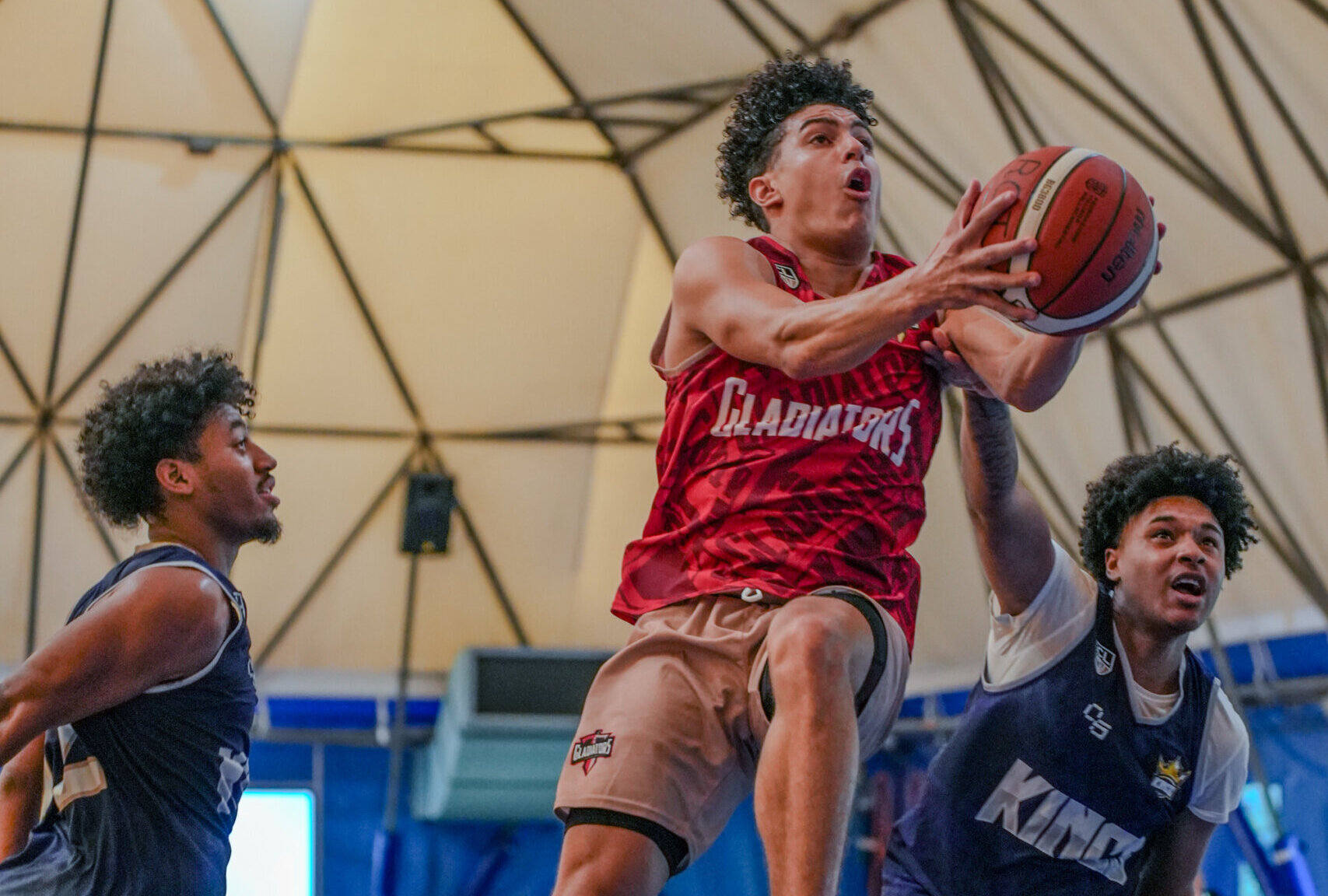 Rome City Institute basketball player driving to the basket