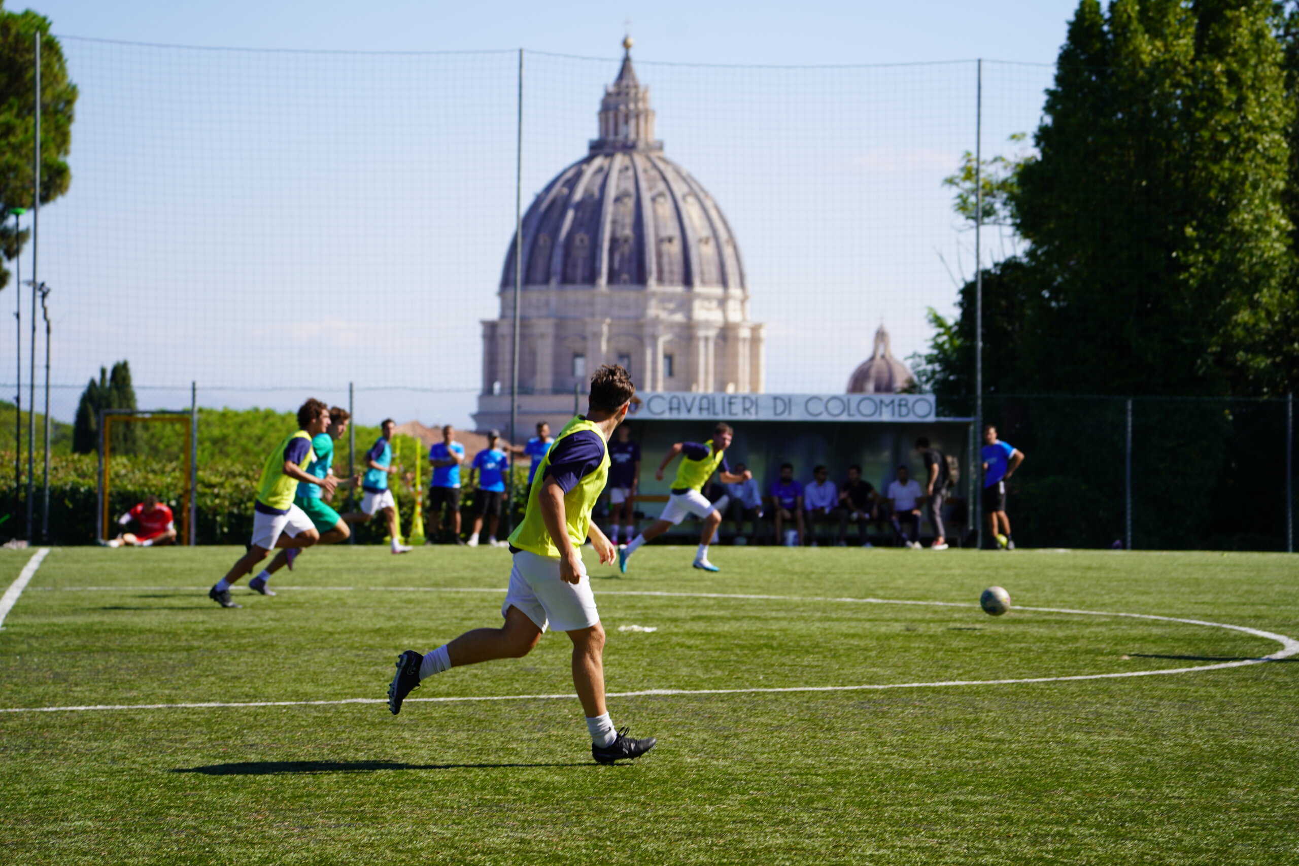 Rome City Institute soccer student-athletes training with St. Peter's Basilica in the background