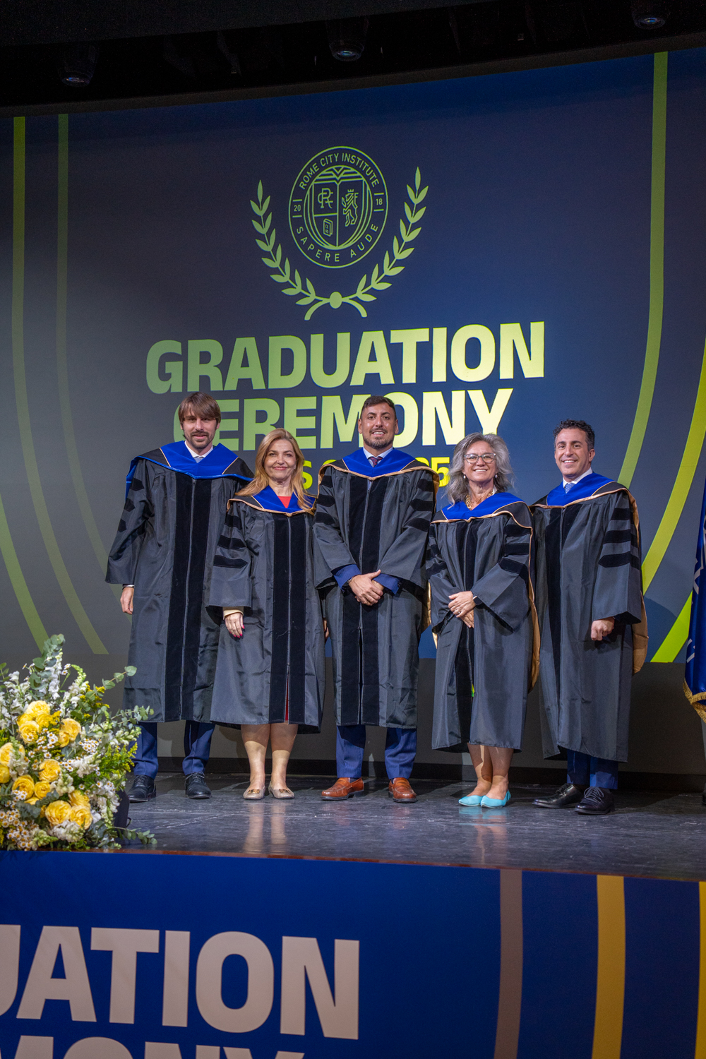 Rome City Institute leadership on stage at the graduation ceremony