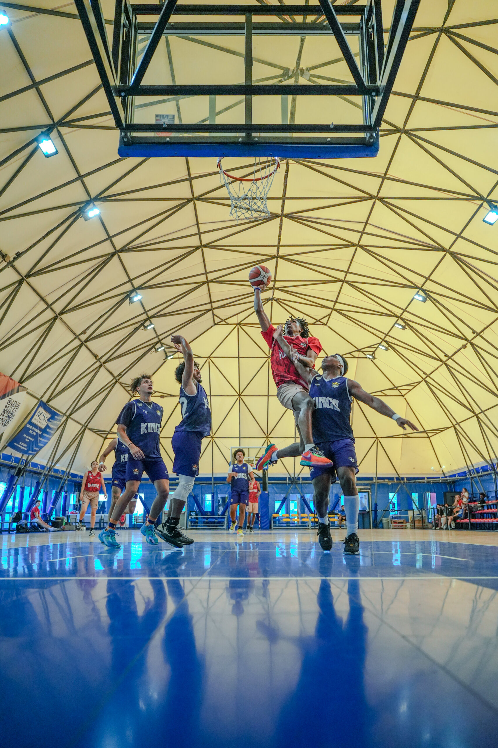 Rome City Institute basketball player driving to the basket in a game