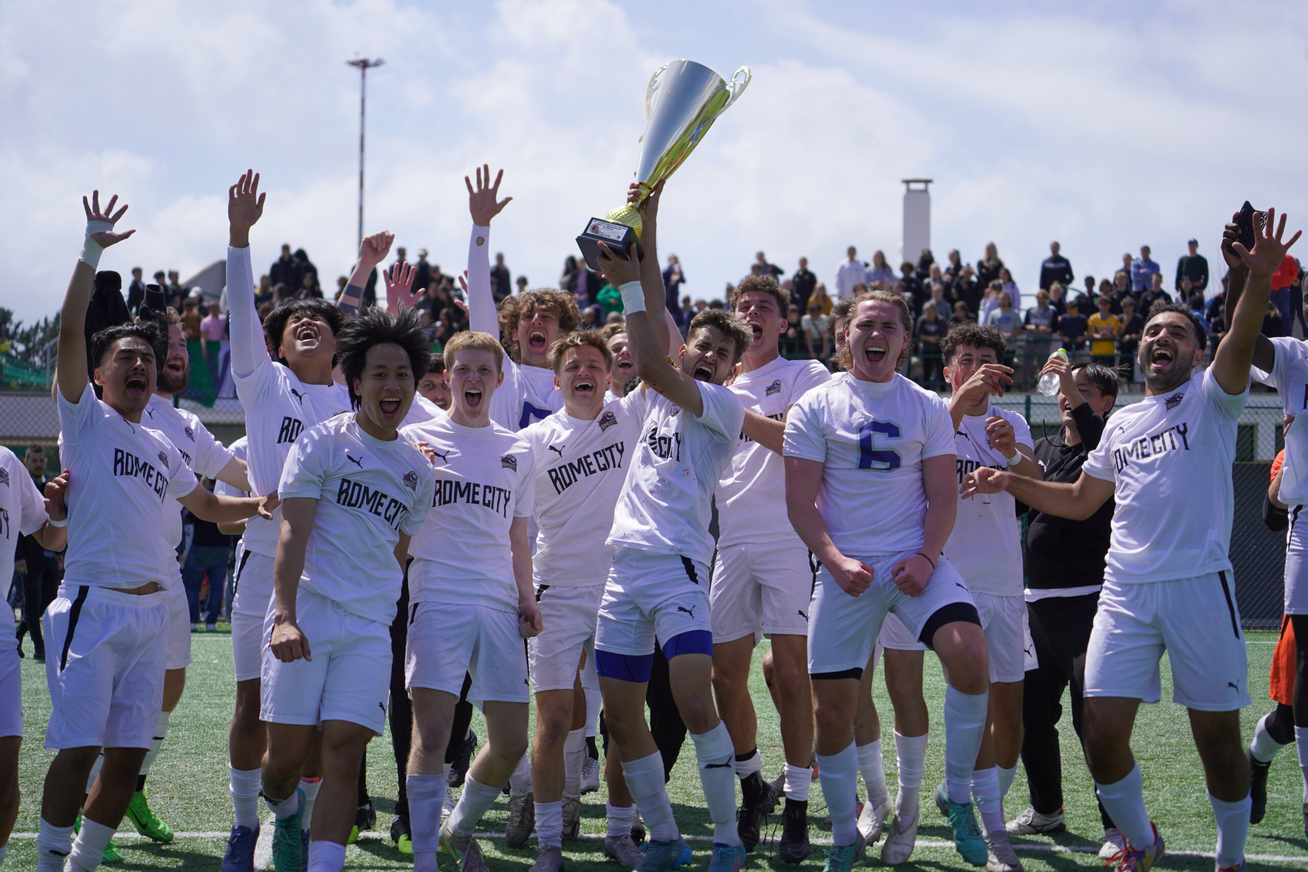Rome City Institute men's soccer team celebrating their 2023/24 University League of Rome championship